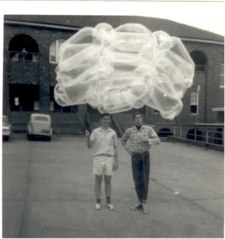 Bill Lloyd and Bob McInnes holding the dry-cleaning bag balloon, 1967
